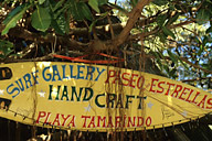 Costa Rica: Playa Tamarindo, sign made from surfboard for local gallery