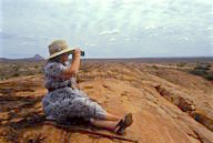 Kenya: Tsavo East National Park, Daphne Sheldrick looking through binoculars for game.