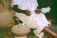Ghana: Boku (Borong-Ahafo Region), hands of elder grandmother spinning yarn