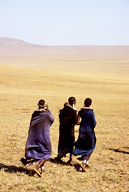 Three Maasai women walking on plains, Ngorongoro Crater Conservation Area, Tanzania