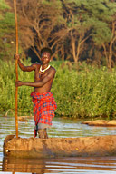 Dassanech man with canoe, Omo River Delta
