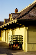 Missouri: St Charles, historic depot with luggage wagon, July.