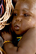Kundama Farm, a Duss tribal farming community, a Karo baby in mother’s arms